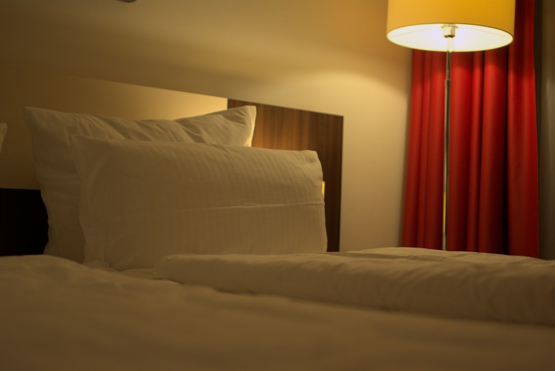 Hotel in Holiday Inn Express & Suites Absecon - a bed with white sheets and pillows in a room